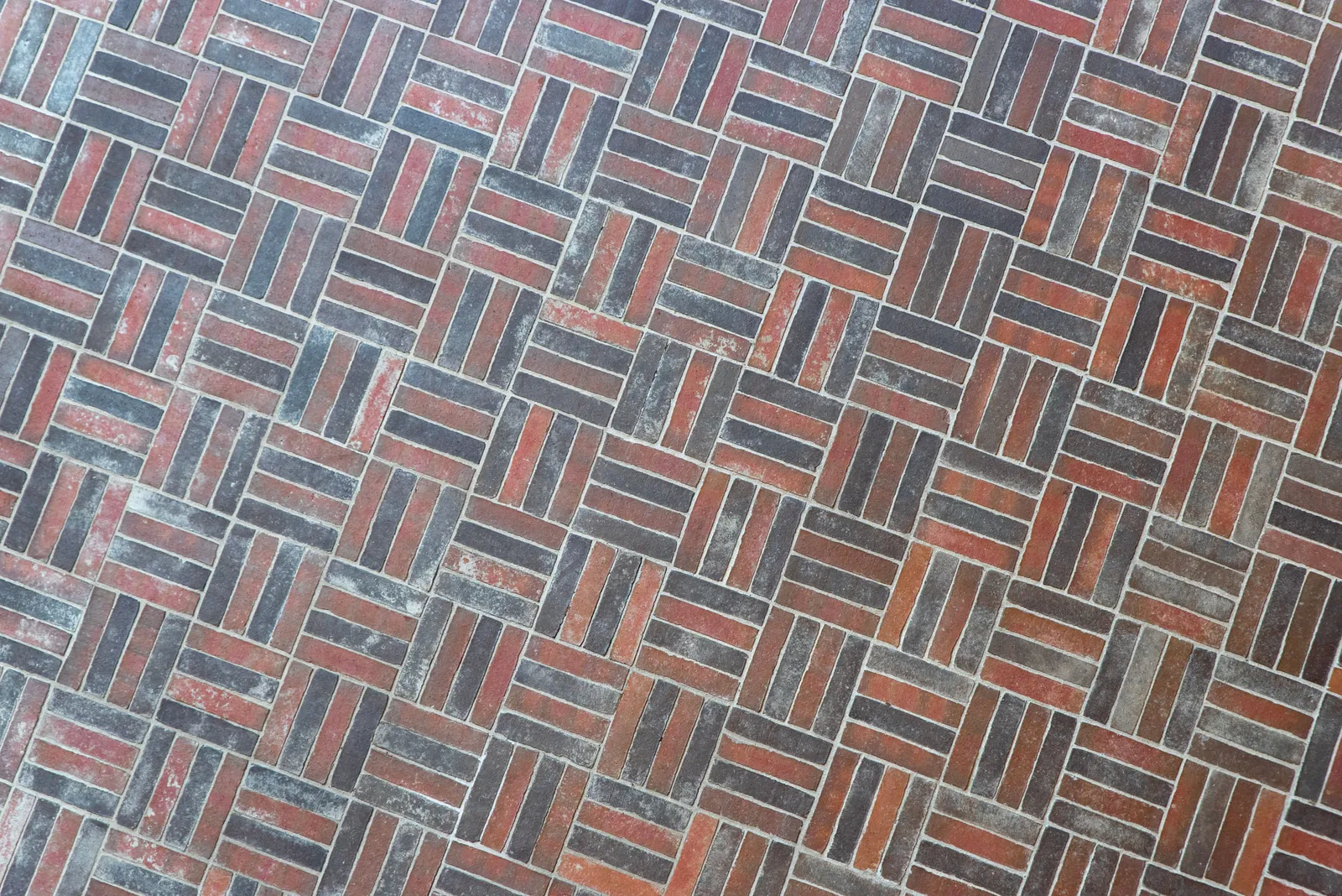 Close-up of basketweave pavers showing paired horizontal and vertical blocks