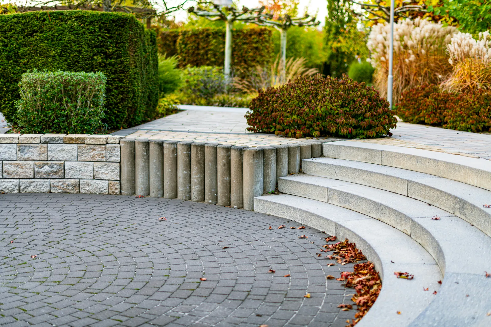 Geometric paver patio with a contrasting border band framing a seating area