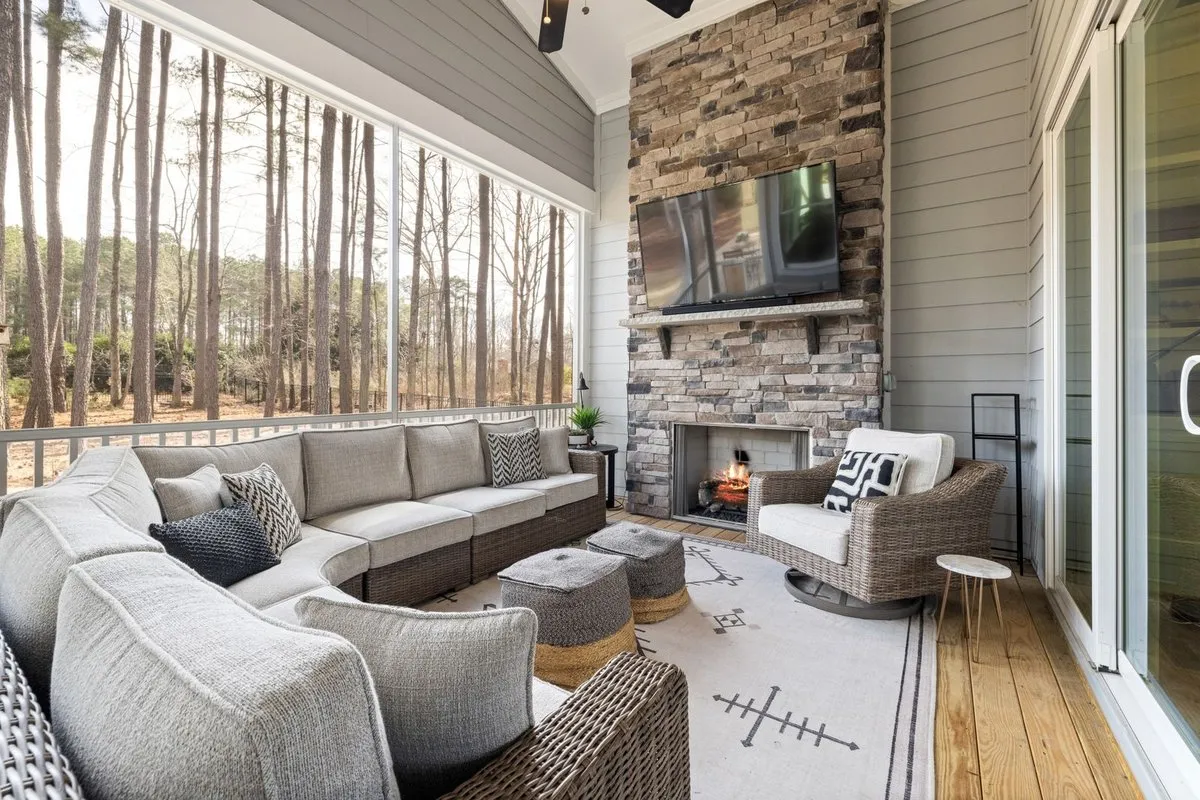 Beautiful maintained paver patio with outdoor furniture and greenery